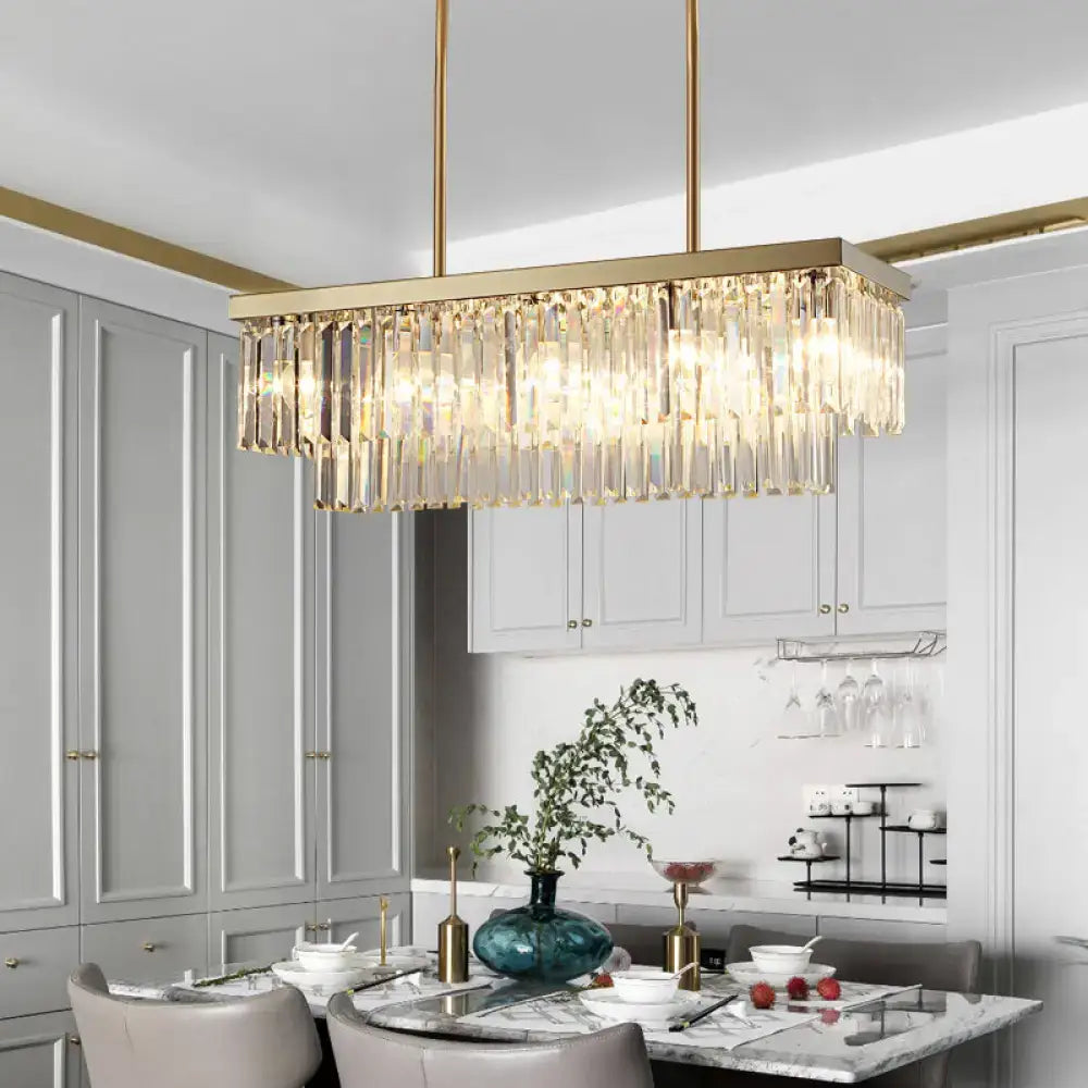 Gold-toned rectangular contemporary light fixture with cascading clear amber crystal prisms for dining room chandelier