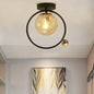 Contemporary Clear Glass Ceiling Light: Spherical Semi Flush Fixture with Single Bulb, Black Mount and Globe/Bird Decor