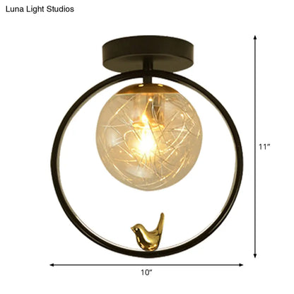 Contemporary Clear Glass Ceiling Light: Spherical Semi Flush Fixture with Single Bulb, Black Mount and Globe/Bird Decor