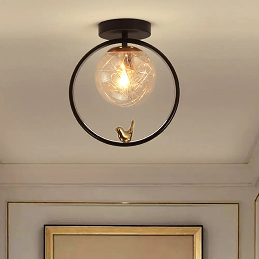 Contemporary Clear Glass Ceiling Light: Spherical Semi Flush Fixture with Single Bulb, Black Mount and Globe/Bird Decor