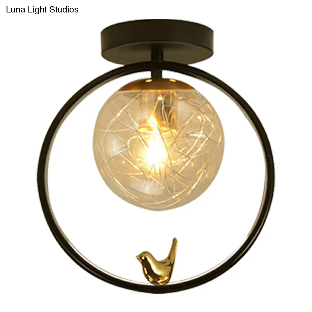 Contemporary Clear Glass Ceiling Light: Spherical Semi Flush Fixture with Single Bulb, Black Mount and Globe/Bird Decor