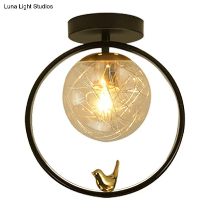 Contemporary Clear Glass Ceiling Light: Spherical Semi Flush Fixture with Single Bulb, Black Mount and Globe/Bird Decor