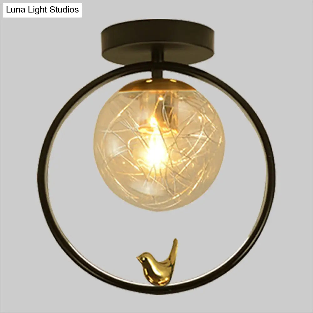 Contemporary Clear Glass Ceiling Light: Spherical Semi Flush Fixture with Single Bulb, Black Mount and Globe/Bird Decor