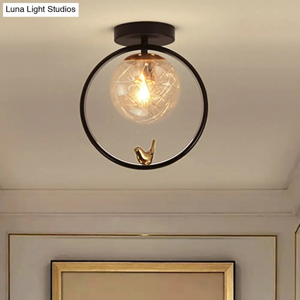 Contemporary Clear Glass Ceiling Light: Spherical Semi Flush Fixture with Single Bulb, Black Mount and Globe/Bird Decor