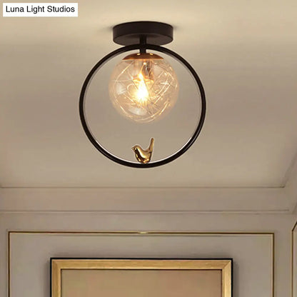 Contemporary Clear Glass Ceiling Light: Spherical Semi Flush Fixture with Single Bulb, Black Mount and Globe/Bird Decor