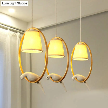 Contemporary Cone Fabric Pendant Lamp with Wood Ring and Resin Bird - 1/3 Lights, White Fixture