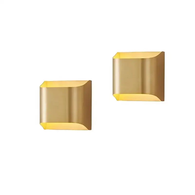 Contemporary copper brass wall sconce with gold finish sleek angular design and softly curved edges for living room decorbites