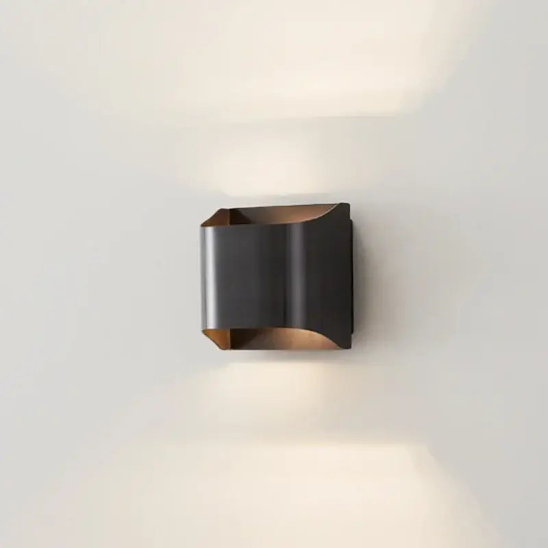 Contemporary copper brass wall sconce with modern black and bronze sleek angular design for living room decorbites contemporary copper