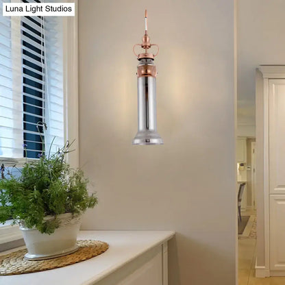 Contemporary copper wall sconce bedroom light with smoke gray amber glass shade and polished chrome body with rose gold accents