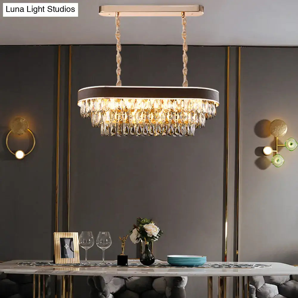 Contemporary crystal block oval island lamp light fixture with gold-toned frame and cascading clear crystal droplets