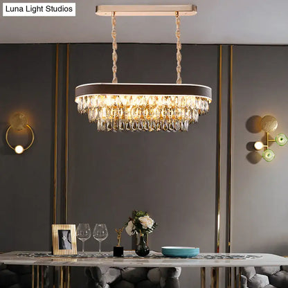 Contemporary crystal block oval island lamp light fixture with gold-toned frame and cascading clear crystal droplets