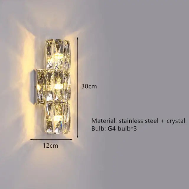 Contemporary crystal wall sconce with a gold frame and crystal accents featuring three warm g4 bulbs for decorbites contemporary crystal decor