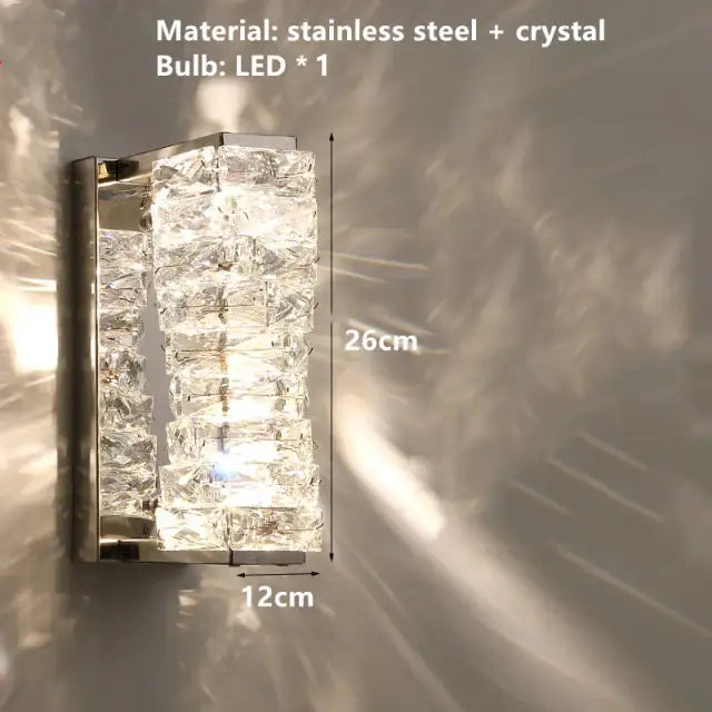 A contemporary crystal wall sconce with stacked faceted crystals in a sleek stainless steel decorbites contemporary crystal frame