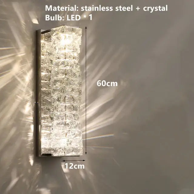 A sleek 60cm tall decorbites contemporary crystal wall sconce with stacked crystal segments and gold frame