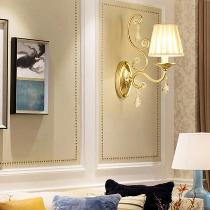 DecorBites™ DecorBites™ Contemporary Crystal Wall Sconce with Curved Arm and Brass Finish