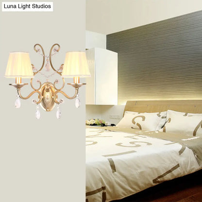 DecorBites™ DecorBites™ Contemporary Crystal Wall Sconce with Curved Arm and Brass Finish