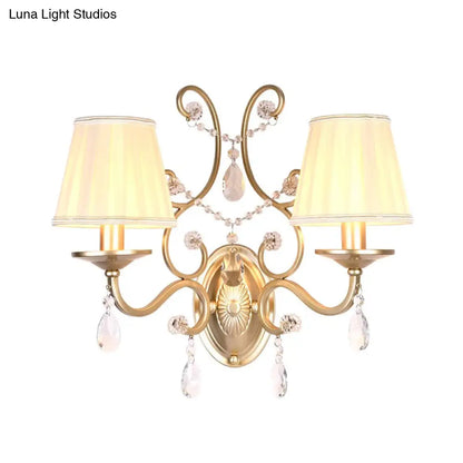 DecorBites™ DecorBites™ Contemporary Crystal Wall Sconce with Curved Arm and Brass Finish