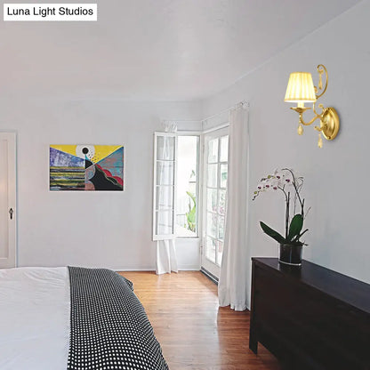 DecorBites™ DecorBites™ Contemporary Crystal Wall Sconce with Curved Arm and Brass Finish