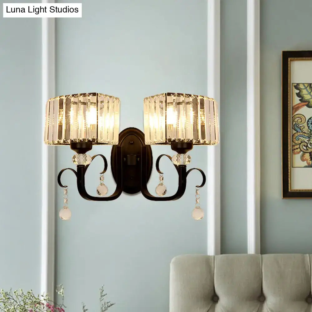 Elegant dark bronze metal wall sconce light with two faceted crystal shades and dangling clear glass orbs for bedroom wall lamp