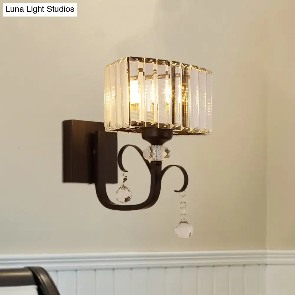 Contemporary dark bronze metal wall sconce with crystal vertical glass panels ideal as elegant bedroom wall lamp