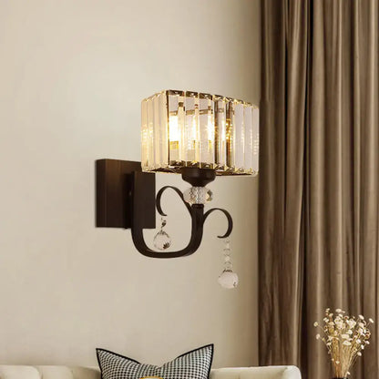 Contemporary dark bronze metal wall sconce with clear glass droplets as a crystal sconce light wall lamp