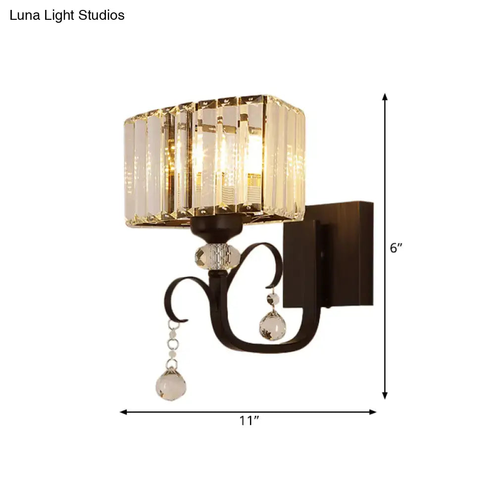 Contemporary dark bronze metal wall sconce with crystal accents and faceted glass panels for bedroom wall lamp