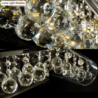 Lámpara colgante de isla DecorBites™ de cristal contemporáneo con 5 luces cilíndricas horizontales y detalle de bola de cristal.