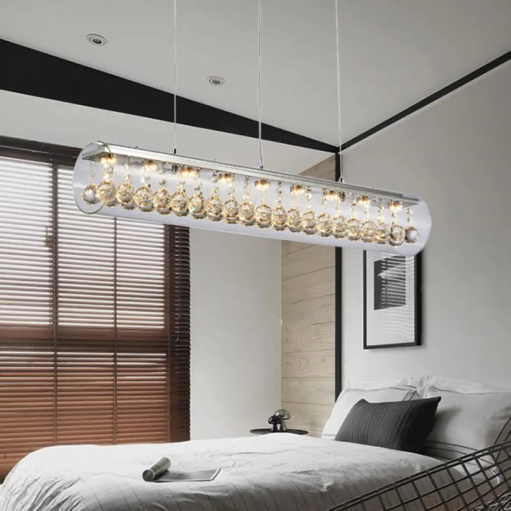 Lámpara colgante de isla DecorBites™ de cristal contemporáneo con 5 luces cilíndricas horizontales y detalle de bola de cristal.