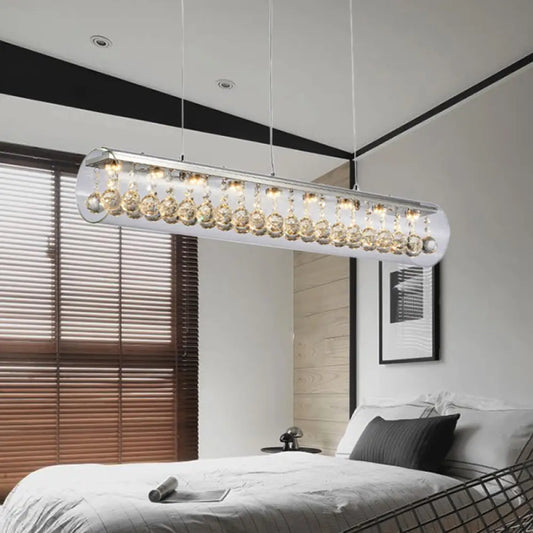 Lámpara colgante de isla DecorBites™ de cristal contemporáneo con 5 luces cilíndricas horizontales y detalle de bola de cristal.