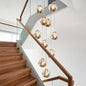 Contemporary Gold Ball Chandelier with Amber Dimpled Glass Pendant - 10 Bulbs, Multi-Light for Living Room