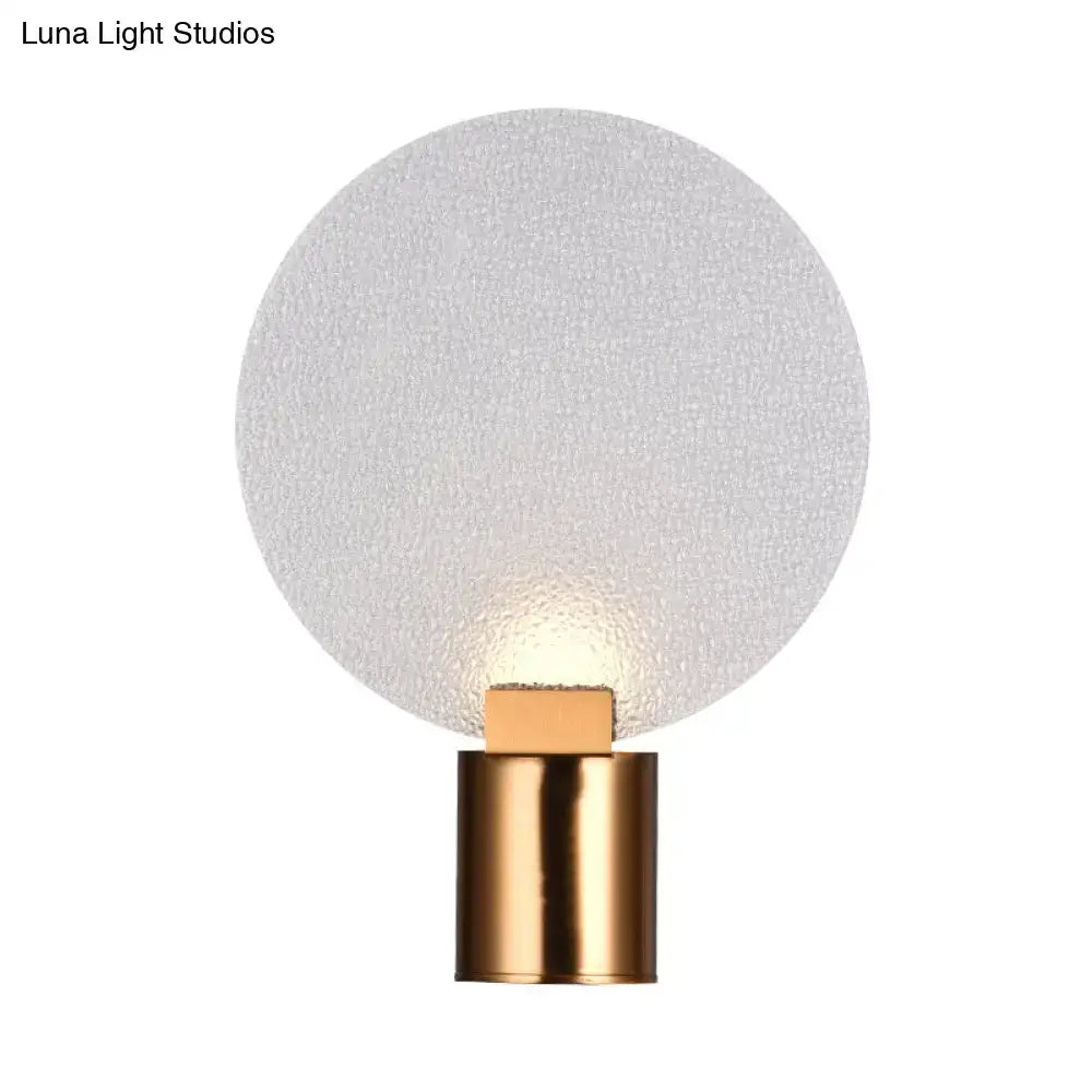 Contemporary gold bubble glass wall lamp with frosted glass globe and polished brass base for bedroom sconce use