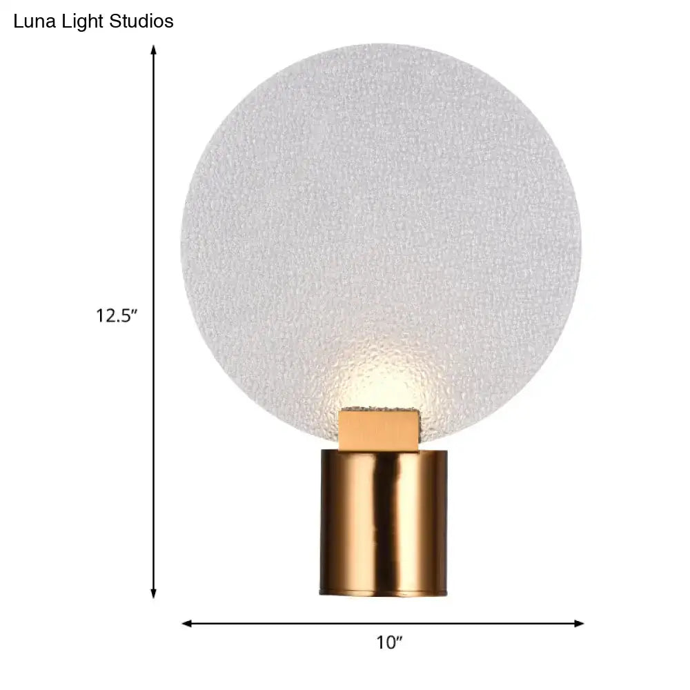 Contemporary gold bubble glass wall lamp with frosted glass globe and polished brass base for bedroom sconce