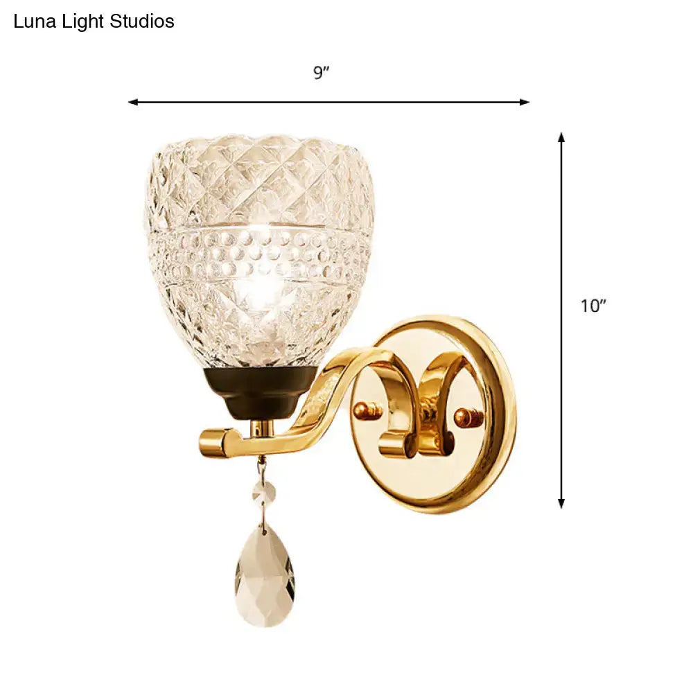 Contemporary gold crystal drop wall sconce with faceted glass shade and teardrop crystal pendant for bedroom use