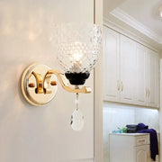 Contemporary gold crystal drop wall sconce with faceted glass shade and dangling teardrop crystal pendant inch fixture