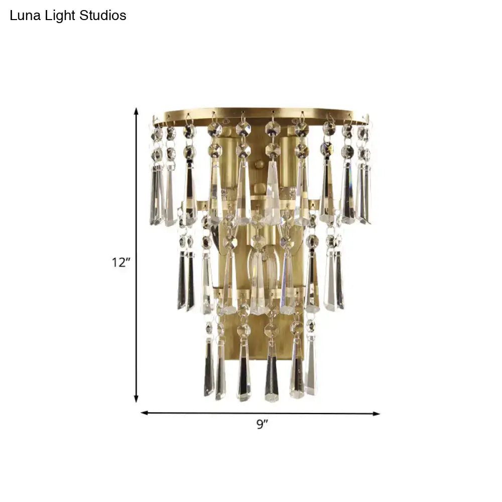 Contemporary gold crystal flute tiered wall sconce lighting with cascading clear crystal teardrops and beads for bedroom