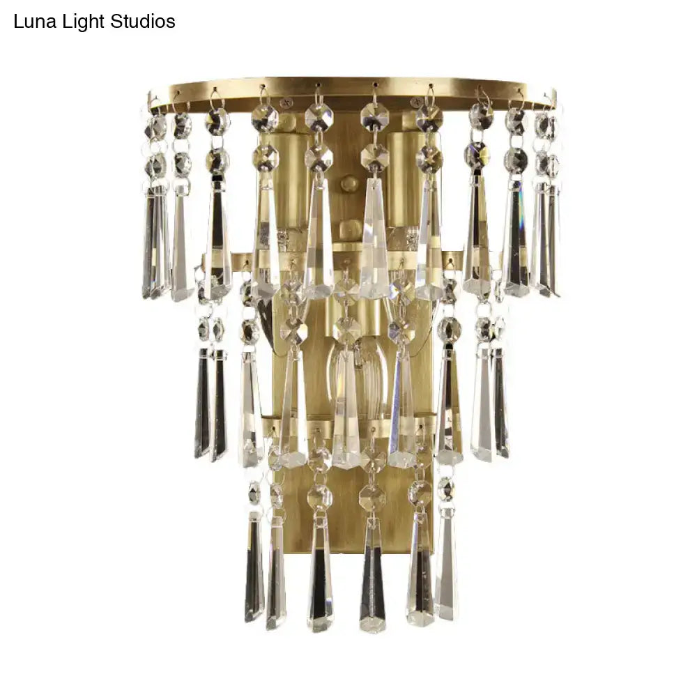 Contemporary gold crystal flute tiered wall sconce lighting with brass finish and cascading clear crystal prisms and beads