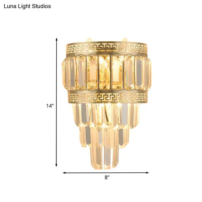 Contemporary gold wall lamp with greek key pattern and cascading crystal prisms 12 inch fixture for bedroom light