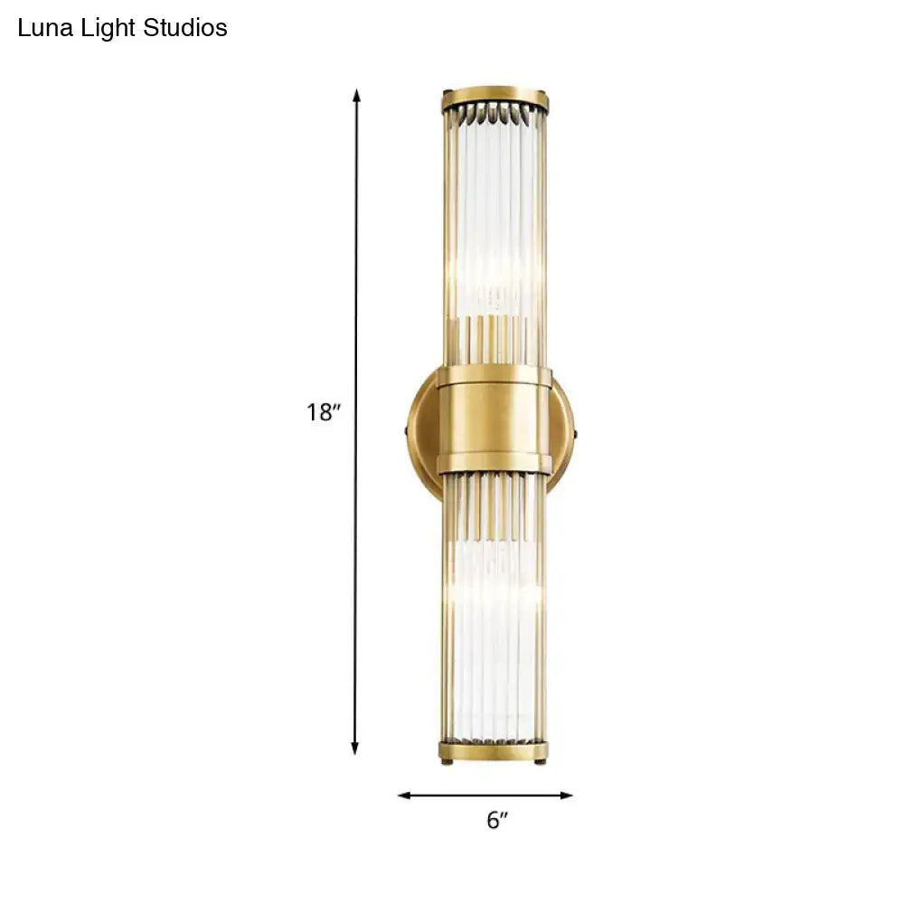 Contemporary gold crystal light fixture with brushed brass finish and ribbed glass panels for living room walls