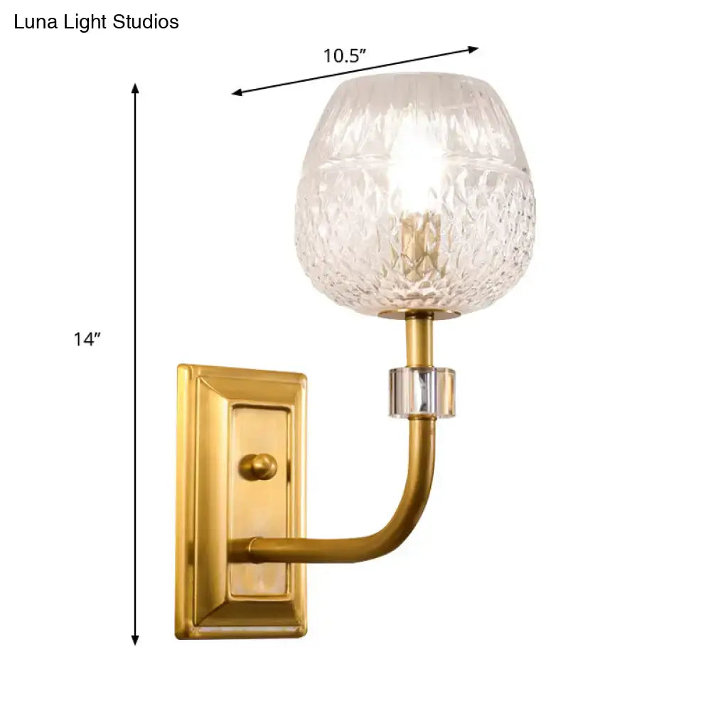 Brass-finished wall light featuring a dome foyer wall design with clear lattice glass and crystal accent globe