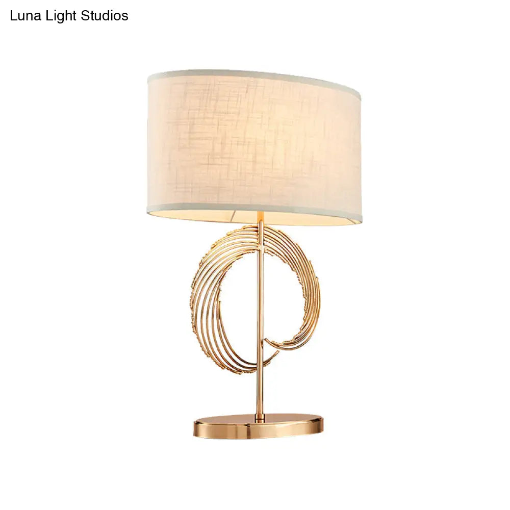 Lámpara de mesa contemporánea dorada estilo tambor - Elegante lámpara de dormitorio