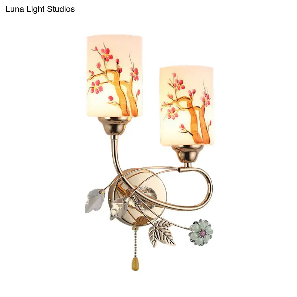 Contemporary gold finish wall lamp with cream glass shades featuring hand-painted cherry blossom branches and ornate accents