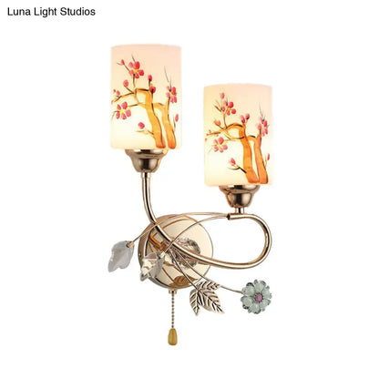 Contemporary gold finish wall lamp with cream glass shades featuring hand-painted cherry blossom branches and ornate accents