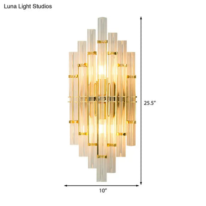 Contemporary gold finish crystal tube wall sconce with cascading translucent glass tubes ideal for bedroom lighting