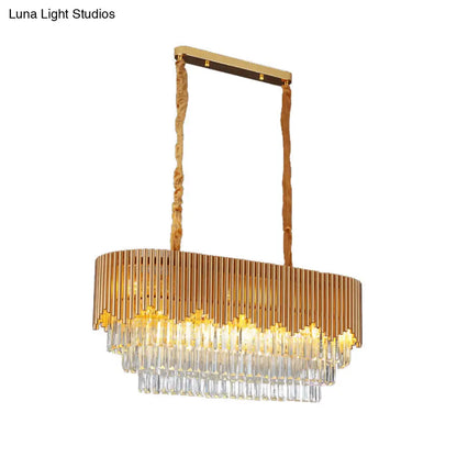 Lámpara de isla DecorBites™ de estilo contemporáneo con acabado dorado, 8 bombillas, bloques de cristal facetado y diseño colgante ovalado.