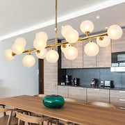 Contemporary gold flush mount chandelier with frosted opal glass globes for dining room lighting