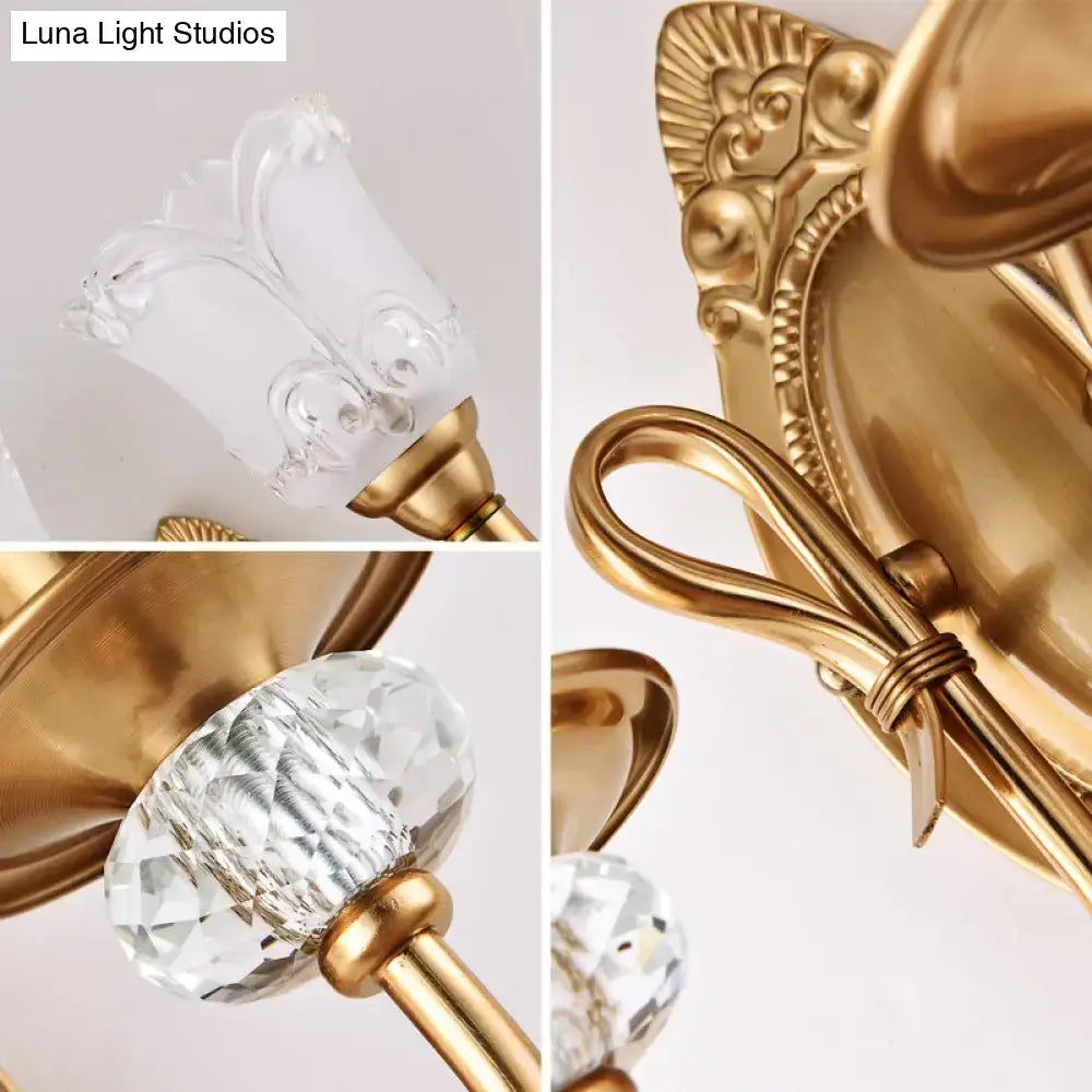 Contemporary gold wall lamp with frosted glass petal shades featuring ornate chandelier style and crystal accents