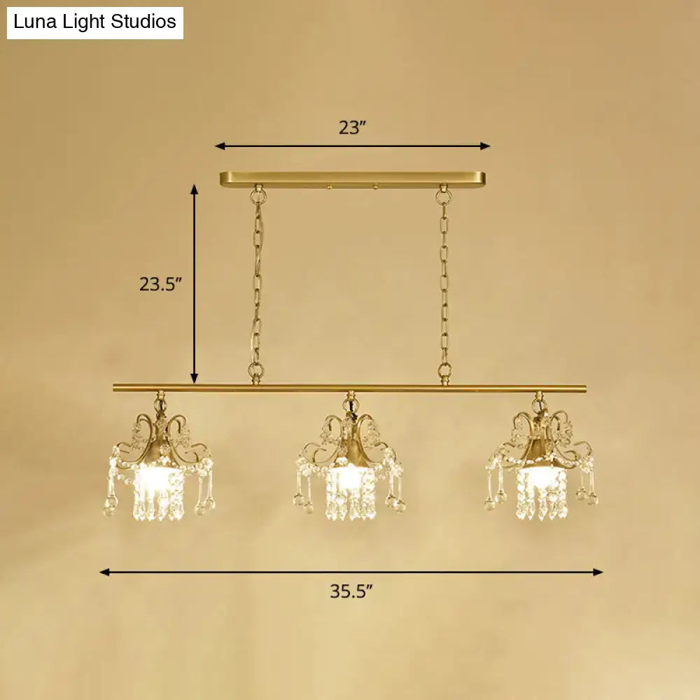 Decorbites™ contemporary gold island chandelier with scroll frame and three ornate crystal pendant lights suspended by chains