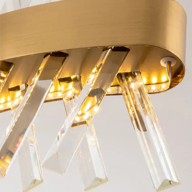 Contemporary gold led crystal chandelier with clear prisms and embedded lighting for elegant living room decorbites contemporary led