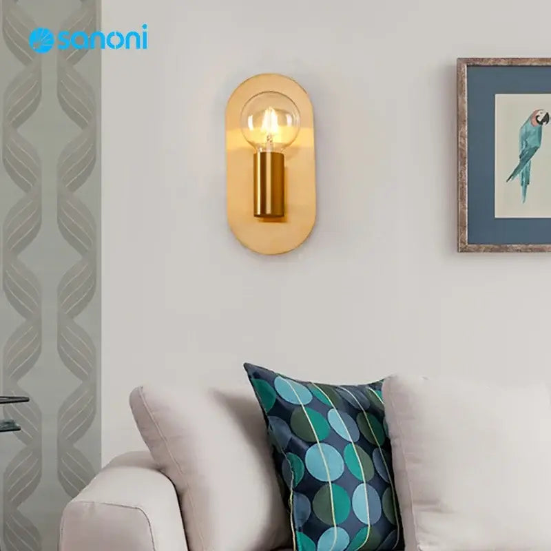 Contemporary gold led wall lamp with gold-toned oval metal sconce and visible filament bulb for living room decorbites wall lamp