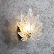 Contemporary gold maple leaf bedroom wall light with translucent frosted glass and warm crystal glow sconce